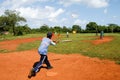 Boys playing baseball on a field at Las Galeras Royalty Free Stock Photo