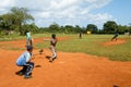 Boys playing baseball on a field at Las Galeras Royalty Free Stock Photo