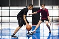 Boys playing basketball together on the court Royalty Free Stock Photo