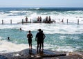 Boys playing in dangerous ocean conditions