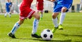 Boys Playing Football Game. Kids Running After Ball. Junior Level Soccer Tournament Match Outdoor Royalty Free Stock Photo