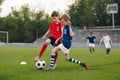 Boys playing a football game in a school tournament. Football soccer match for children Royalty Free Stock Photo