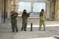 Boys playing with gun during laser tag Royalty Free Stock Photo