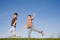 Boys Playing on a Hill