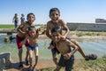 Boys playing in an irrigation channel near Harran in Turkey.