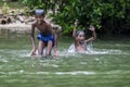 Boys playing in the Madu River near Balapitiya in Sri Lanka.