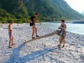 Boys playing near Fella river, Northeast Italy Royalty Free Stock Photo