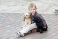 Boys playing with two dogs labrador black and white Royalty Free Stock Photo