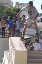 Boys practice in a skating area during an extreme sports outdoors show