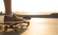 Boys practicing skateboarding during the sunset Royalty Free Stock Photo