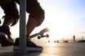Boys practicing skateboarding during the sunset Royalty Free Stock Photo