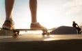 Boys practicing skateboarding during the sunset Royalty Free Stock Photo