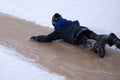 Boys ride with big ice slide. Royalty Free Stock Photo