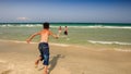 Boys Run into Azure Ocean Waves Swim Gambol in Foam
