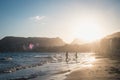 Boys running on the beach in the sunset Royalty Free Stock Photo