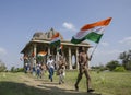 Boys running with indian flag