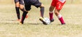 Boys Running and Kicking Football on the Sports Field. Two Youth Soccer Players Compete for the Soccer Ball Royalty Free Stock Photo