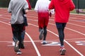 Boys running on a track in a group Royalty Free Stock Photo