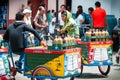 Boys Sitting on bicycle with Cold Drinks and