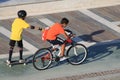 Boys with skates and bicycle in relax and sport