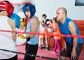 Boys sportsmans at boxing workout with instructor