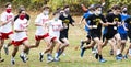 Boys starting a cross country running race wearing face masks in November 2020