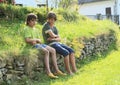 Boys on stone wall Royalty Free Stock Photo