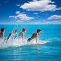 Boys surfers surfing running jumping on surfboards Royalty Free Stock Photo