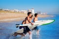Boys surfers surfing running jumping on surfboards Royalty Free Stock Photo