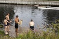 Boys swim in a canal near the lake Royalty Free Stock Photo