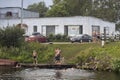 Boys swim in a canal near the lake Royalty Free Stock Photo