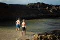 Boys swimming at The Tanks at Forster, NSW Australia