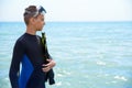 BOYS OF TEENAGERS IN A DIVING BLACK SUIT WITH A DIVING MASK , FLIPPERS Royalty Free Stock Photo