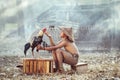 Boys, Thai farmer children playing with gamecocks Which is his pet Was remembered after returning from a rural school,Thailand Royalty Free Stock Photo