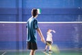 Boys training badminton indoor activity sport