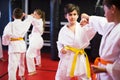 Boys training in pair to use taekwondo technique during class