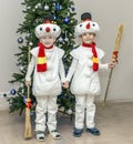 Boys, twins in carnival costumes of snowmen Royalty Free Stock Photo