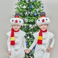Boys, twins in carnival costumes of snowmen Royalty Free Stock Photo