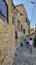 Boys walking in the stone streets of Lofou village in Cyprus Island