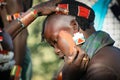 Boys wear makeup for the bull jumping ceremony, Ethiopia