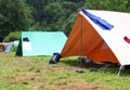 Boyscout tent in a field with clothes that dry