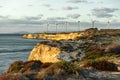 Bozcaada sunset presents a different visual every day with wind roses and lighthouse Royalty Free Stock Photo