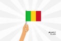 Vector cartoon illustration of human hands hold Mali flag