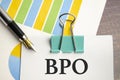 BPO Business Process Outsourcing text on white paper on the desktop Royalty Free Stock Photo