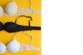 Bra of beige, white and black color on yellow background Royalty Free Stock Photo