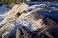 Beautiful cascade waterfall in the autumn forest, silky smooth stream Royalty Free Stock Photo