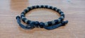 bracelet accessories are brown and black, made from recycled materials or waste around