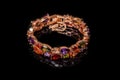 Bracelet with colorful stones on black, close-up Royalty Free Stock Photo