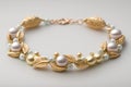 bracelet with delicate pearls and gold accents on white background