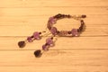 Bracelet and earrings from amethyst and garnet. Handwork.